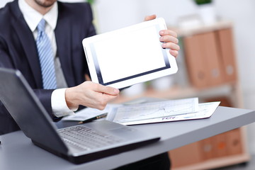 close up.businessman showing tablet with blank screen