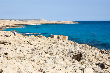 Fototapeta na wymiar Beautiful seascape with blue sea and rocky shore in Cyprus.