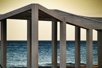 White wooden structure on the beach