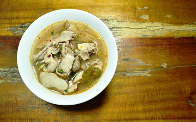 boiled duck bone with herb Thai spicy soup on bowl