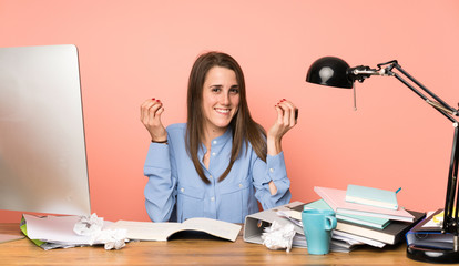 Young student girl making money gesture