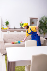 Old female contractor doing housework 
