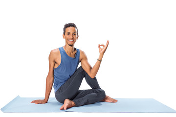 Young man doing yoga exercise