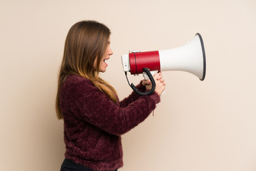 Young girl shouting through a megaphone