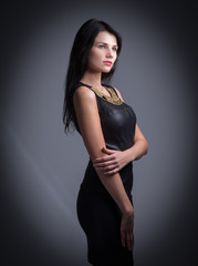 Beautiful woman with red lips in little black dress