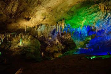 colorful illumination of Prometheus Cave