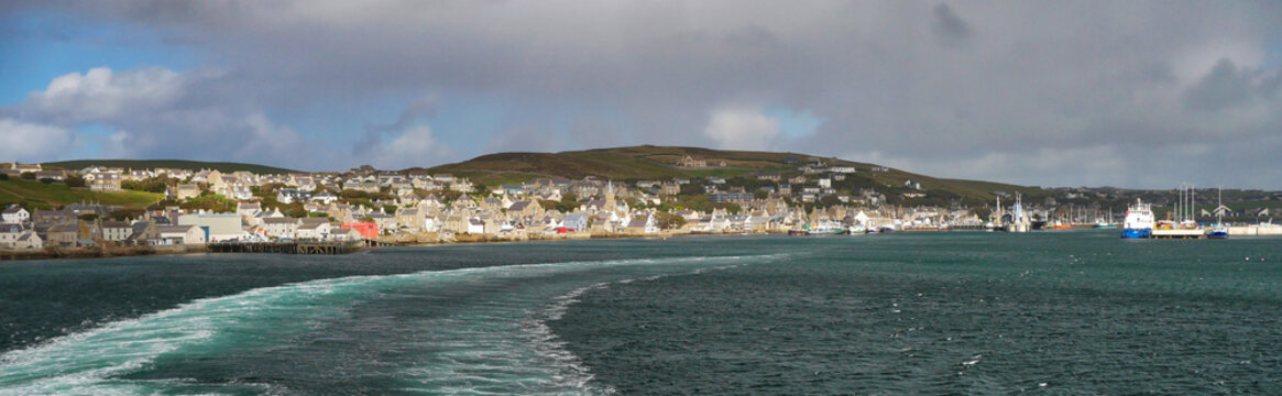A panorama of the port town of Stromness in Orkney, Scotland, UK, from the departing ferry to Scrabster