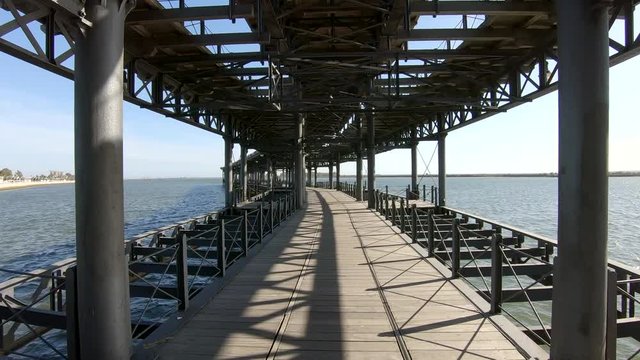 Walking by Mining pier of Riotinto Co., known as the Tinto Dock "Muelle del Tinto" .Huelva, Spain