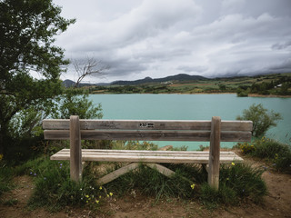 Wooden bench with a view of a flooded land