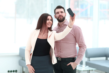 modern business couple taking selfie in office