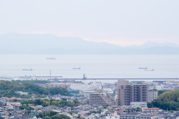 The overlooking of Matsuyama city from castle / 松山城から曇り空の市街地を