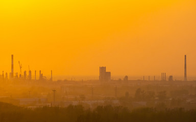 Fototapeta na wymiar sunset over industrial areas with factories