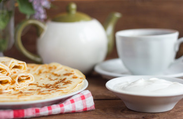 delicious tender pancakes with Breakfast cheese on wooden background, rustic style