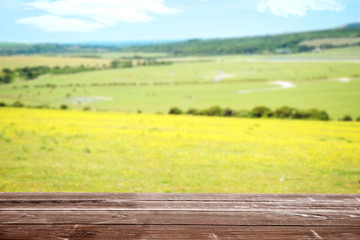 wood deck overlooking farm landscape