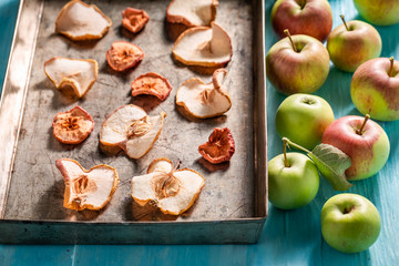 Sweet and fresh dried apples on old baking tray