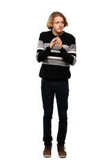Full-length shot of Blonde man scheming something over isolated white background