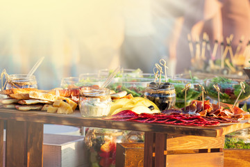 catering table set service with silverware and glass stemware at restaurant before party