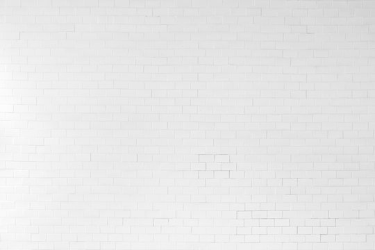 White painted old aged brick tile wall texture background