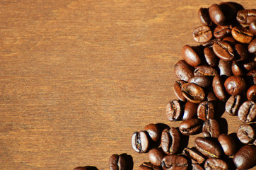 Close-up coffee beans on wooden background, aroma photo