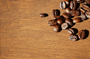 Close-up coffee beans on wooden background, aroma photo