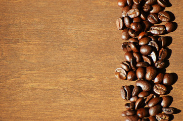 Close-up coffee beans on wooden background, aroma photo