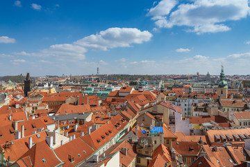 Fototapeta na wymiar Aerial panoramic top view above old town and city skyline with famous attraction; The Powder and Henry's Tower and Television Tower against blue sky on sunny day in summer in Prague, Czech Republic.