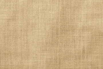 Fototapeta na wymiar Hessian sackcloth woven texture pattern background in light yellow gold cream color