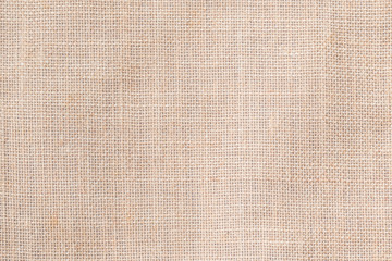 Fototapeta na wymiar Hessian sackcloth woven texture pattern background in light cream beige brown color