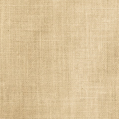 Hessian sackcloth woven texture pattern background in light yellow gold cream brown color