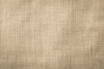 Hessian sackcloth woven texture pattern background in beige cream brown color