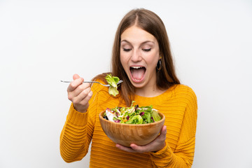 Young woman with long hair with salad