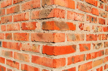 The outer corner of old brick wall