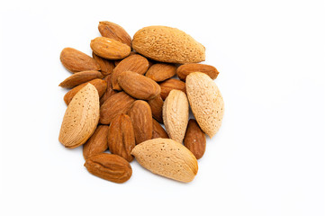 Top view of pile of almonds isolated on white background.