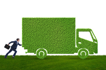 Businessman with green ecological vehicle