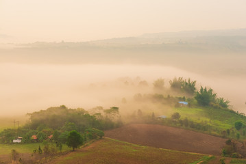 Fototapeta premium Beautiful sunrise over mountain village with fog, Spring Landscape.