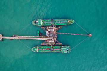 Aerial top view of the ship carrying the lpg and oil tanker in the sea port. For energy export and...