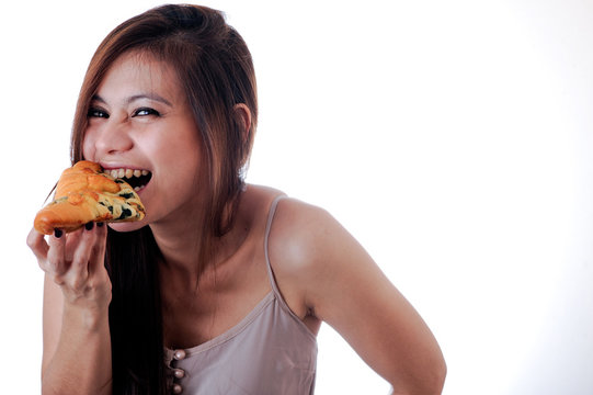 Happy woman eating tasty pizza.