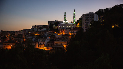 A mosque on a hill at night in Casbah, Algiers, Algeria