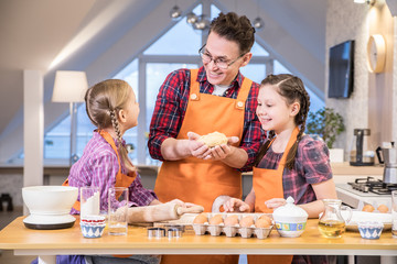 Family cooking in the kitchen at home