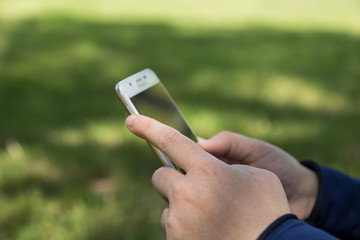 Close up of women's hands holding mobile phone with space screen, girl watching video,writing message,shopping online.