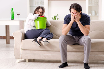 Fototapeta premium Young wife suffering from sick stomach and vomiting