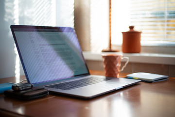 Workspace with laptop and other supplies