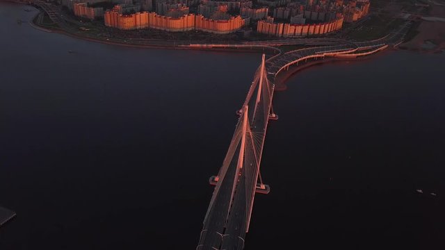 aerial sunset view cable Bridge ZSD road car rooftops zenit arena water Saint Petersburg Russia