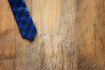 Father's day concept. Necktie over wooden background. top view, flat lay