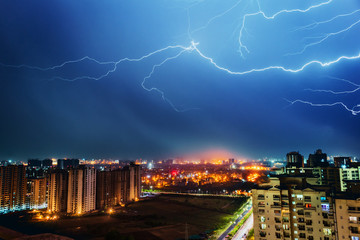 Multiple lighting bolts thunder  during a storm with a dramatic blue sky in noida, delhi India  - Image