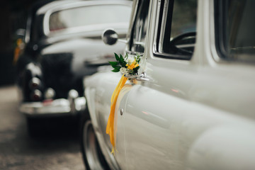 Wedding bouquet on vintage wedding car 