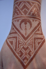 Mehendi pattern on woman's hand