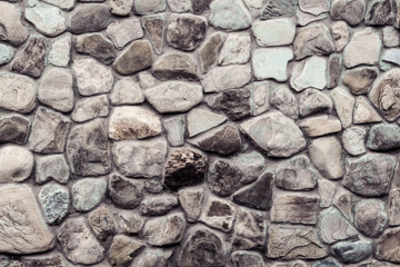 the texture of the wall of stone cobblestones. architecture.