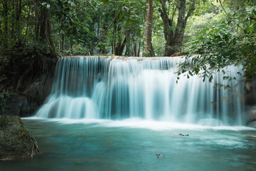 Fototapeta na wymiar Huay Mae Khamin waterfalls in deep forest at Srinakarin National Park ,Kanchanaburi ,A beautiful stream water famous rainforest waterfall in Thailand