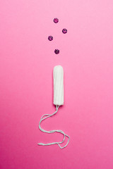 Tampon on pink background